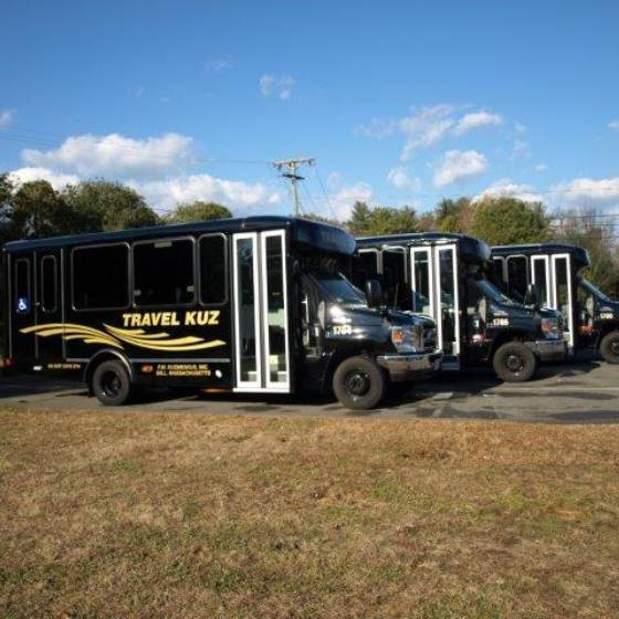 Soccer fans boarding a charter bus in the Berkshires for a group trip to Gillette Stadium during the 2026 FIFA World Cup with TravelKuz